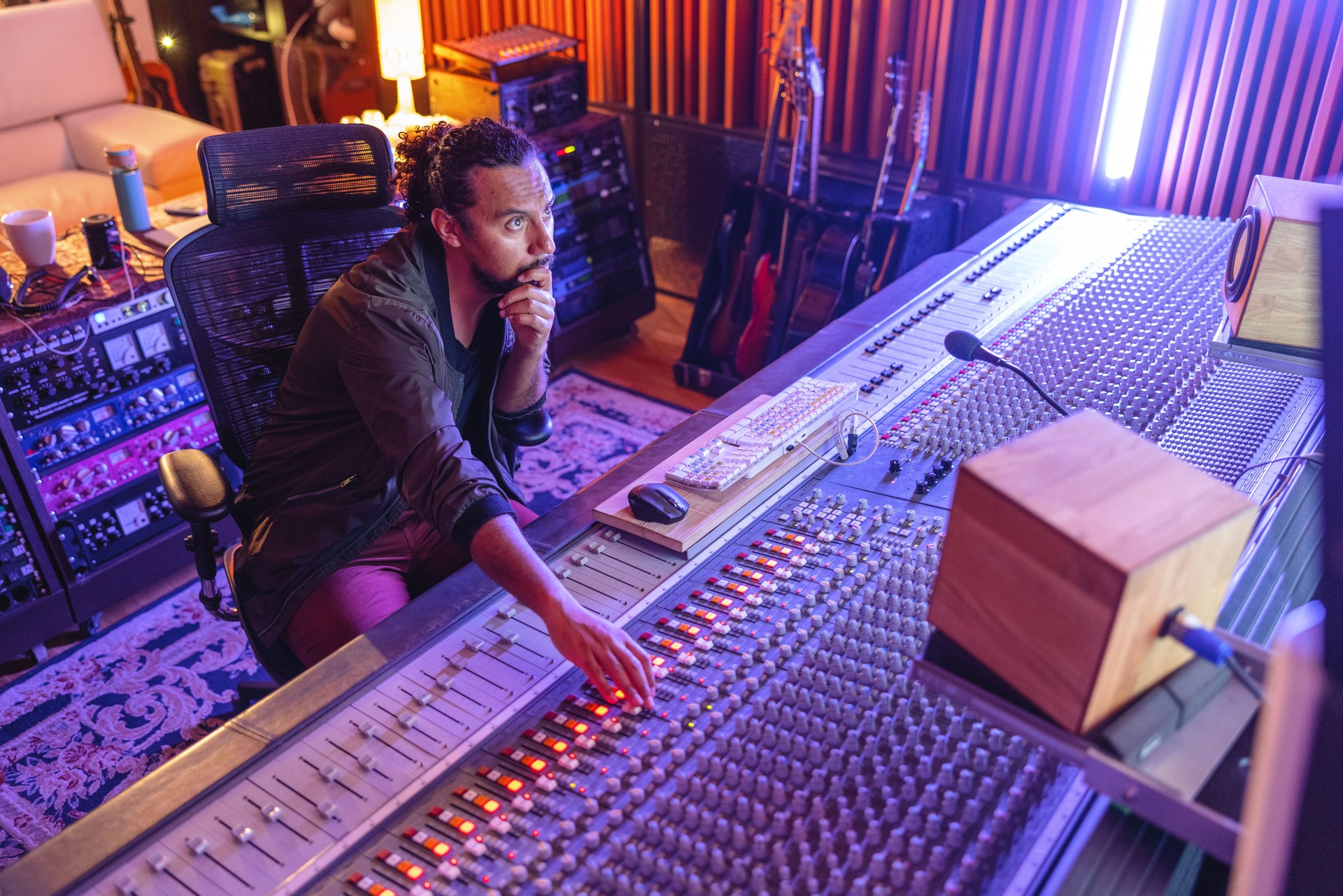 Black Male Audio Engineer At Work In A Beautiful Recording Studio